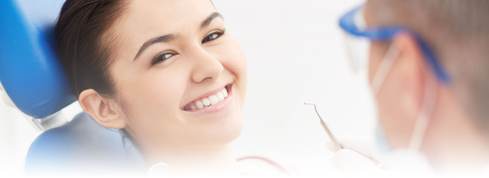 Woman with beautiful smile having dental check up at the crestwood dental group